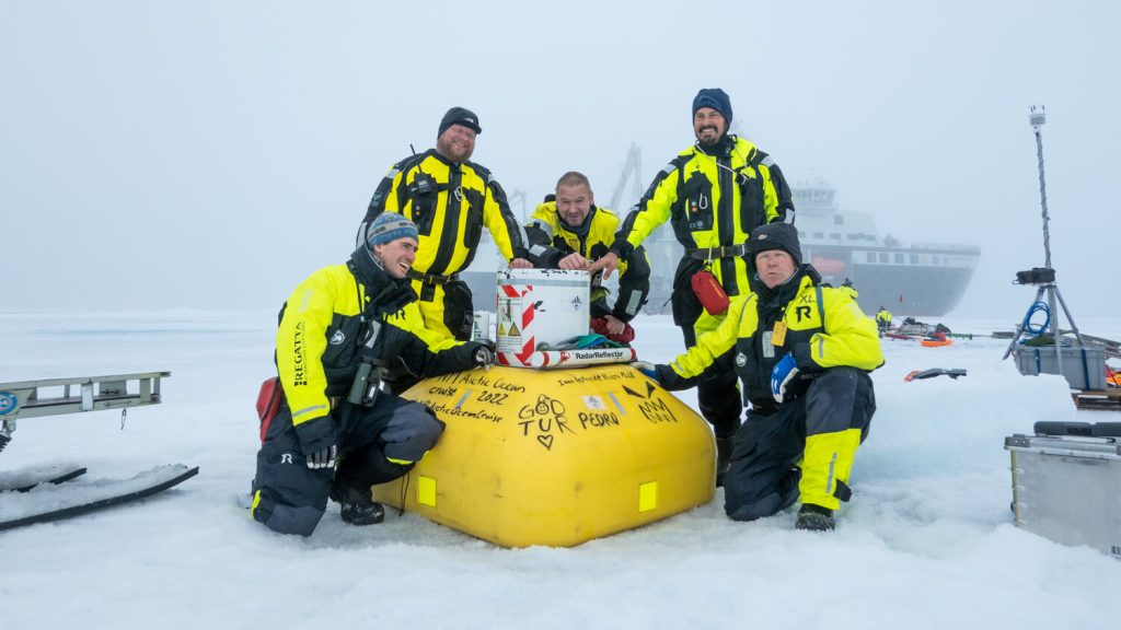 Happy deployment team after the buoy with an acoustic fish and zooplankton profiler was deployed near the North Pole